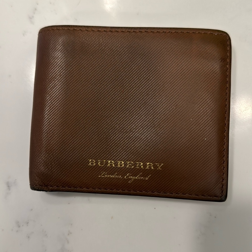 Authentic men’s cognac colored Burberry wallet from Italy. Originally $490